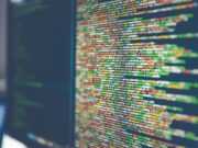 Шифрование данных — ключ к безопасности активов Colorful software or web code on a computer monitor