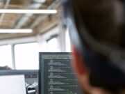 Регулярные обновления ПО для защиты активов man in black shirt sitting in front of computer monitor